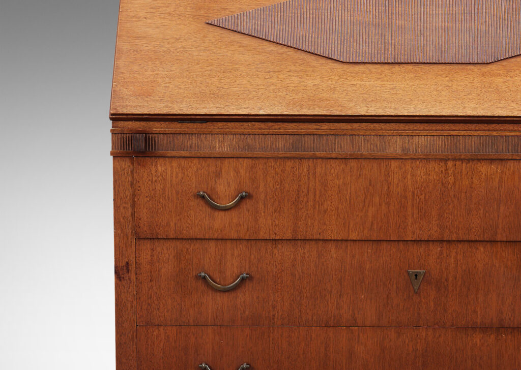 Gallery BAC hree-drawer chest on sabered feet with fold-out desk with storage nooks on top, decorated with ridged bands and ornament