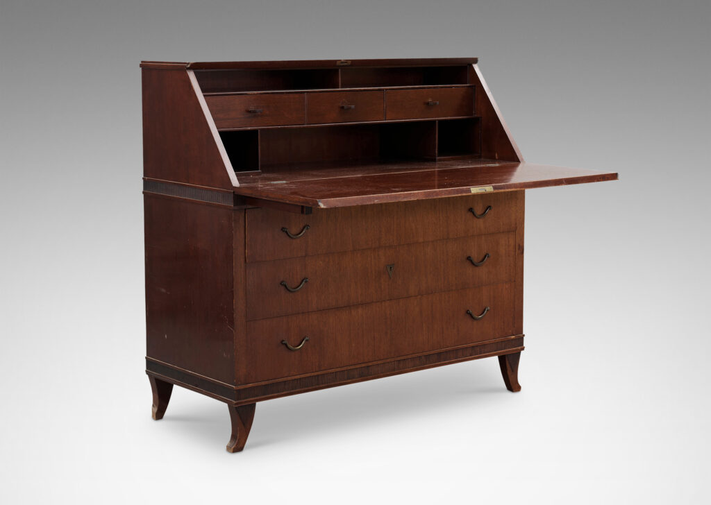 Gallery BAC hree-drawer chest on sabered feet with fold-out desk with storage nooks on top, decorated with ridged bands and ornament