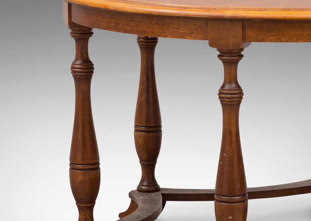 Gallery BAC muscular round top on six baluster legs connected with coved stretchers; walnut