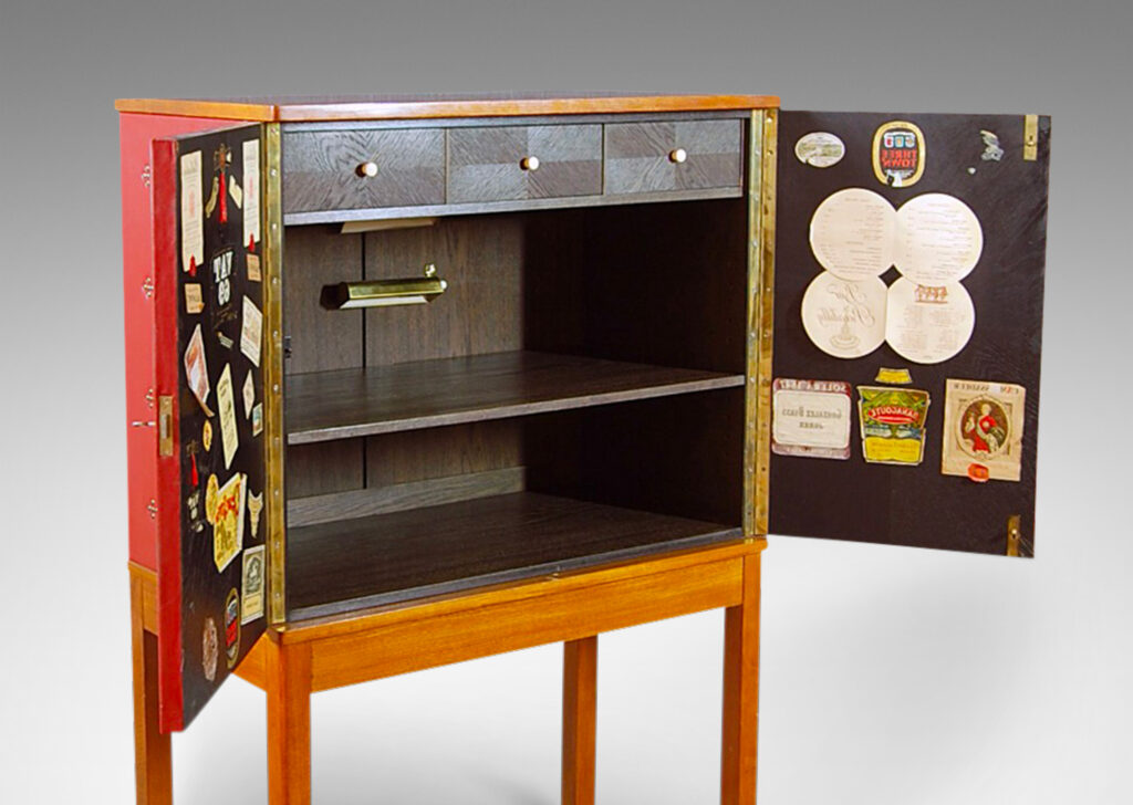 Gallery BAC two-door cupboard with shelves and three small drawers inside, covered in red leather tufted with diamond-form clusters of nail heads