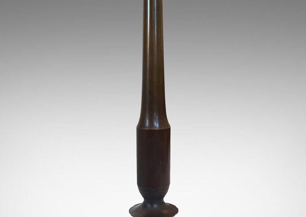 Gallery BAC profiled stands with stylized floral fobs on octagonal bases; patinated bronze