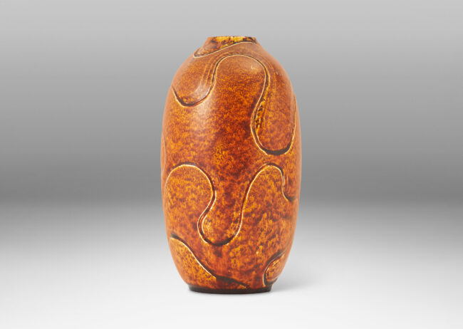 Gallery BAC ovoid form with carved contoured wave pattern, glazed in toffee brown