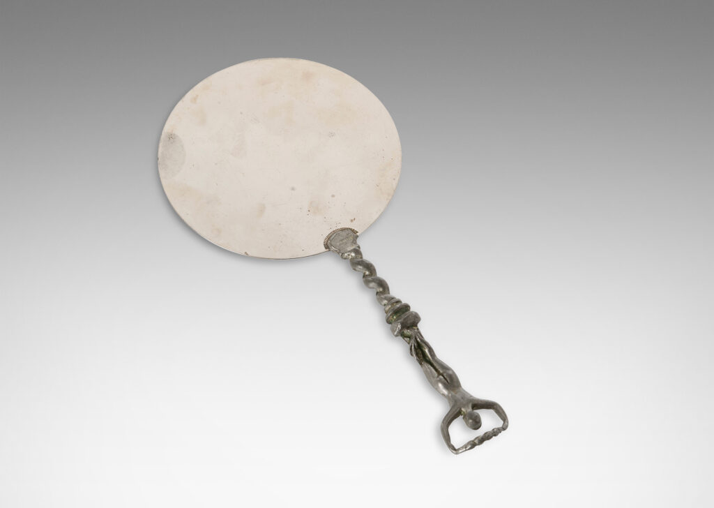 Gallery BAC polished disk with handle in the form of a barley twist with a female figure; pewter and white metal;