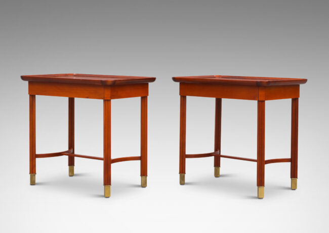 Gallery BAC rectangular tops with sculpted edges, fluted and angled legs, arced stretchers, and brass sabots; mahogany