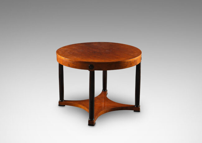 Gallery BAC round top with ebonized column legs connected by a cove-sided shelf stretcher; birch