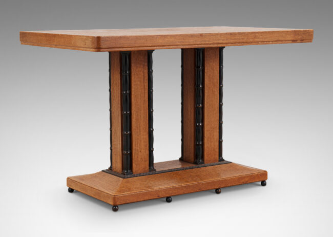 Gallery BAC rectangular top on two pillar pedestals with sculpted and ebonized corner details, on a beveled rectangular base with ball feet