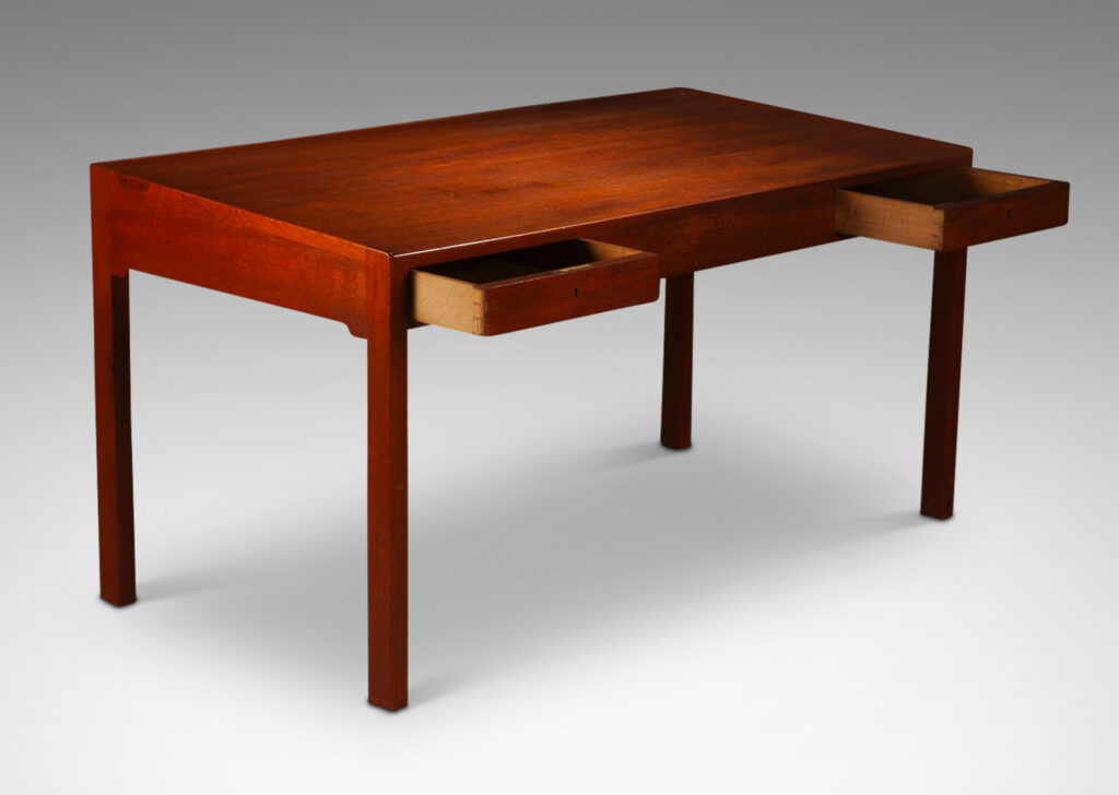 Gallery BAC subtly angled top with two drawers facing the sitter with another on the opposite side, all sensitively modeled in the designer’s signature style