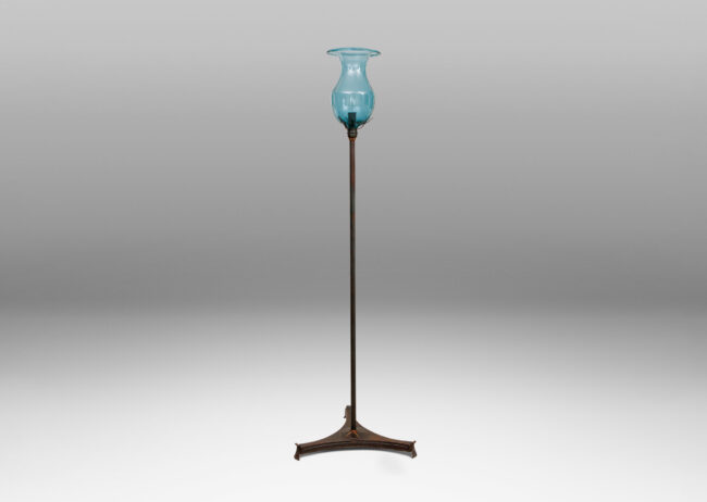 Gallery BAC tall stand on a tripod cove-sided base in a beautiful verdigris patination, with hand-blown cerulean glass shade; bronze