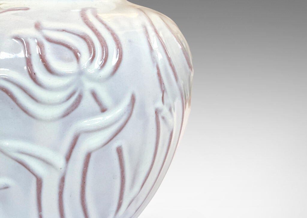 Gallery BAC tapered apple-like forms with abstracted floral designs in relief, glazed in a shiny white