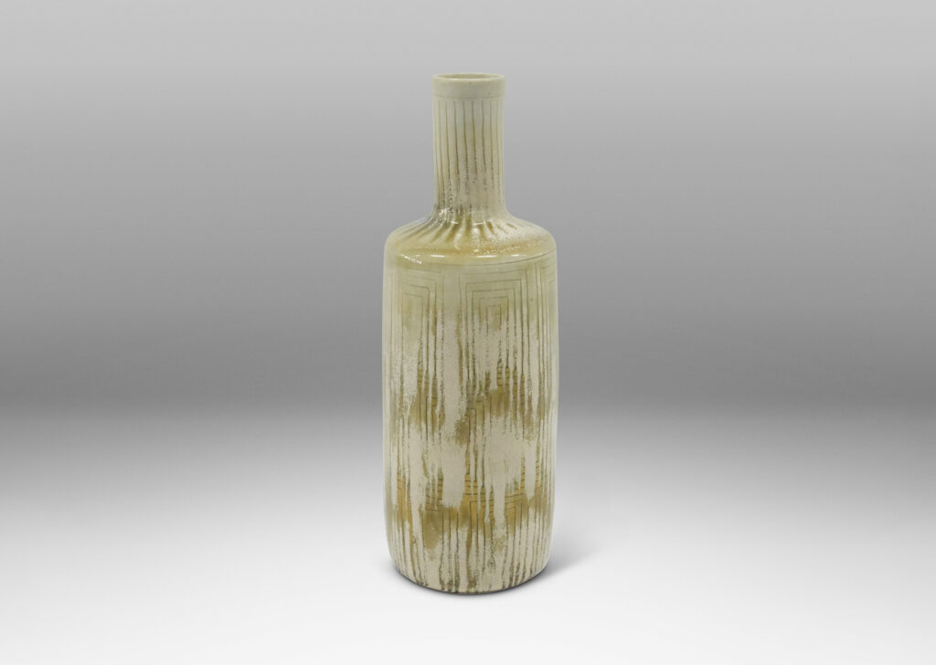 Gallery BAC tall rationalized bottle form, with carved concentric box design and a pale gray-olive green glaze