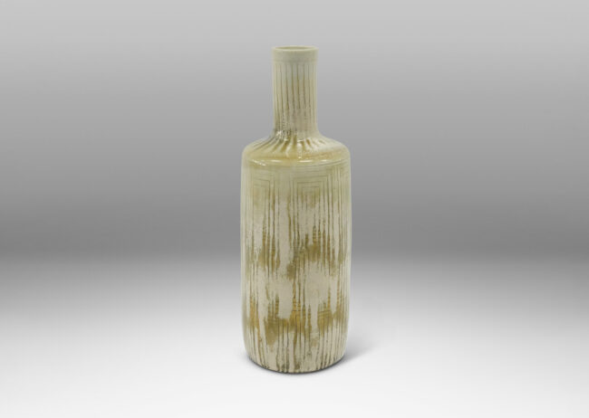 Gallery BAC tall rationalized bottle form, with carved concentric box design and a pale gray-olive green glaze