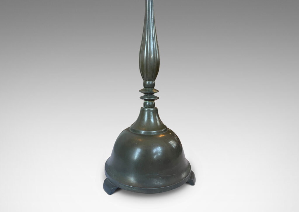 Gallery BAC tall sculpted stand on a bell-form base, all in an antique bronze patination