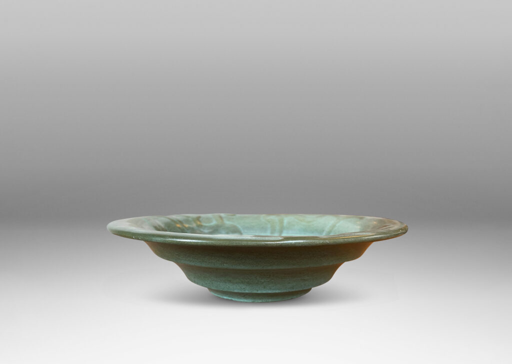 Gallery BAC concentrically lobed form with relief ornaments in gray-green glaze; earthenware