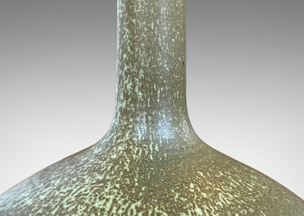 Gallery BAC decanter-like form with low wide drum form and tall neck, glazed in olive green with light green dappling