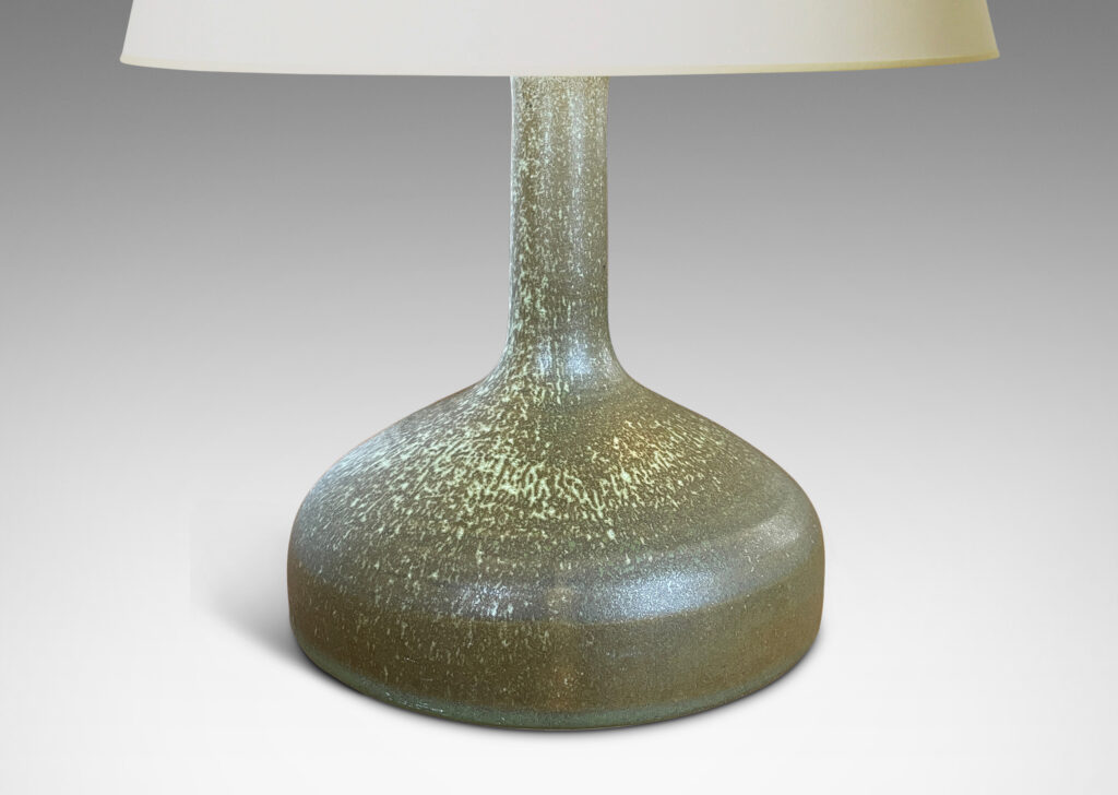 Gallery BAC decanter-like form with low wide drum form and tall neck, glazed in olive green with light green dappling