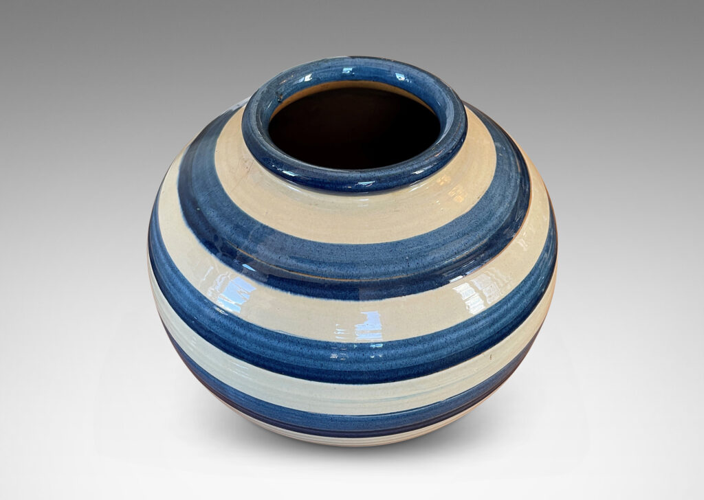 Gallery BAC wide tapering globe form, with beaded lip and plinth base, glazed with horizontal two-tone blue and ivory bands