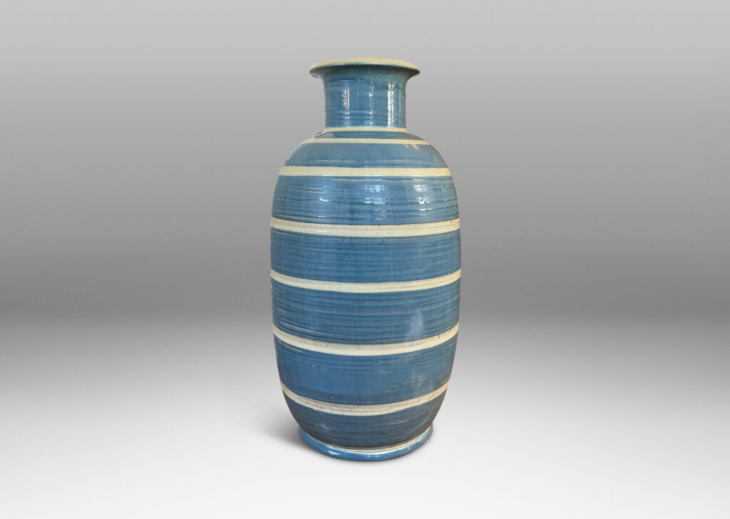 Gallery BAC large upright oval form with wide neck and flared mouth, glazed in gray-blue with ivory stripes