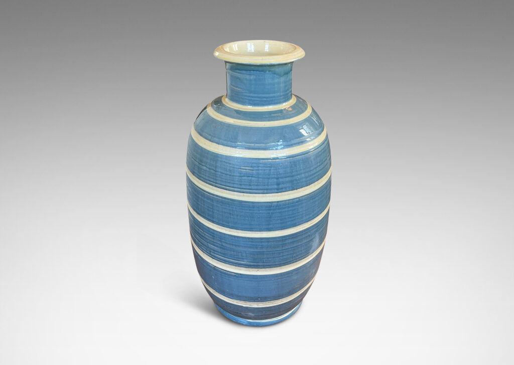 Gallery BAC large upright oval form with wide neck and flared mouth, glazed in gray-blue with ivory stripes