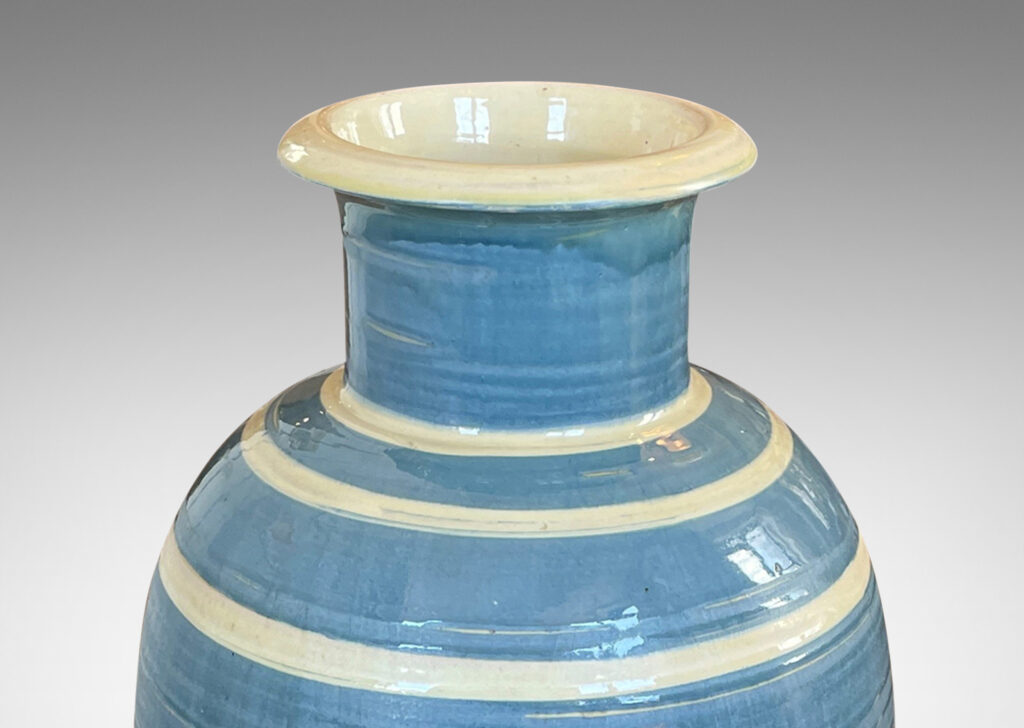 Gallery BAC large upright oval form with wide neck and flared mouth, glazed in gray-blue with ivory stripes