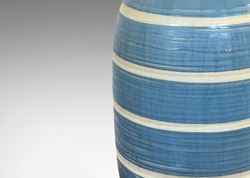 Gallery BAC large upright oval form with wide neck and flared mouth, glazed in gray-blue with ivory stripes