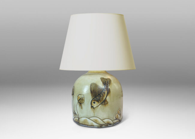 Gallery BAC gumdrop half-round form, carved with charming fish reliefs, glazed in a pale yellow with touches of brown