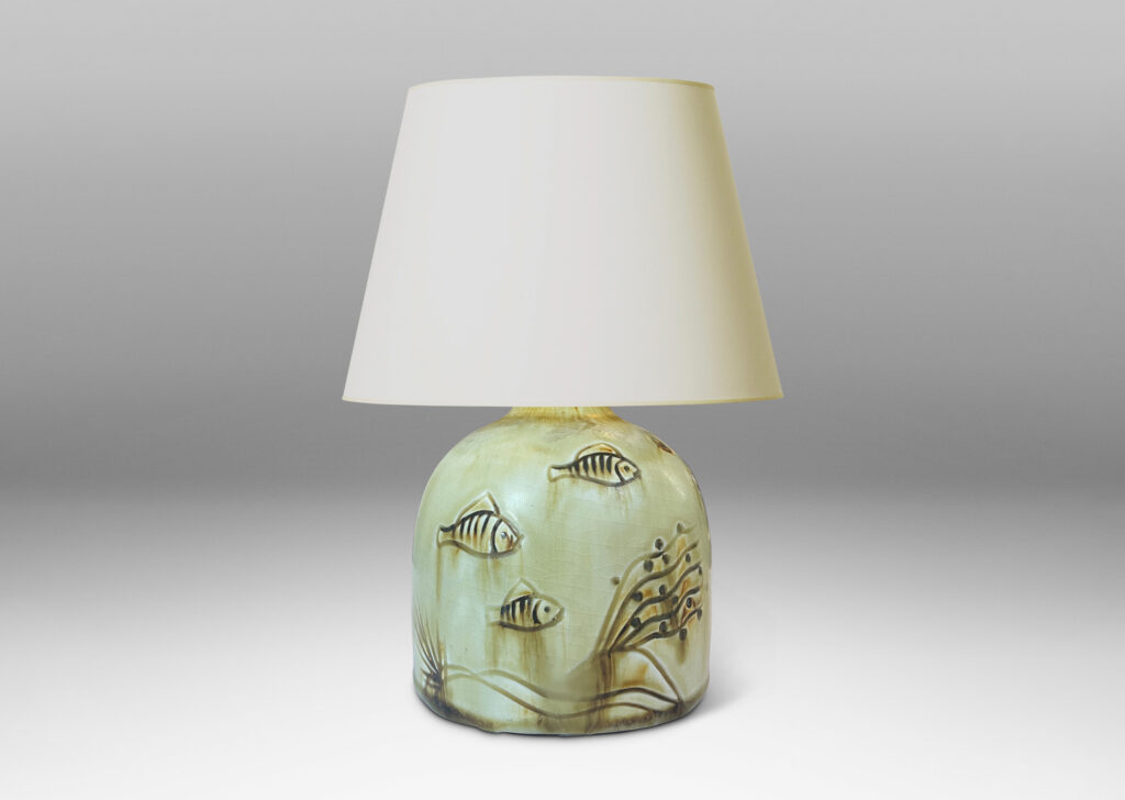 Gallery BAC gumdrop half-round form, carved with charming fish reliefs, glazed in a pale yellow with touches of brown