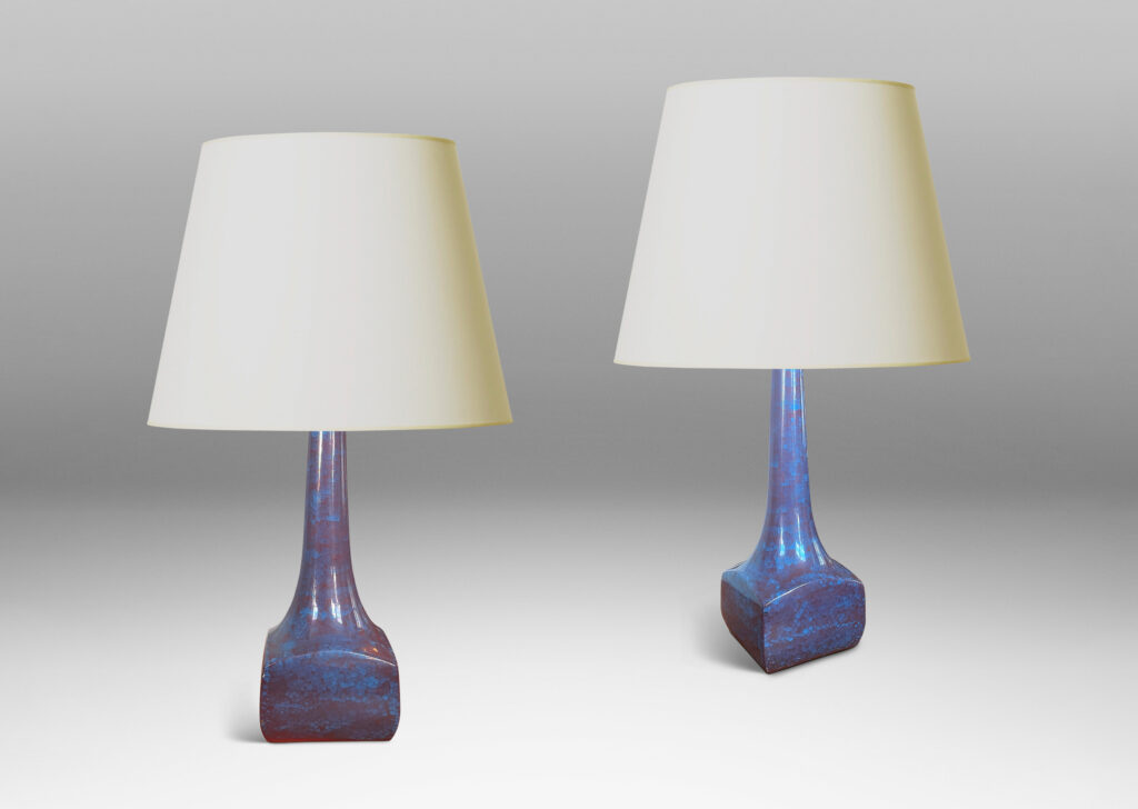 Gallery BAC low square box forms with tall sprouting necks, glazed in a cornflower blue and red luster craquel