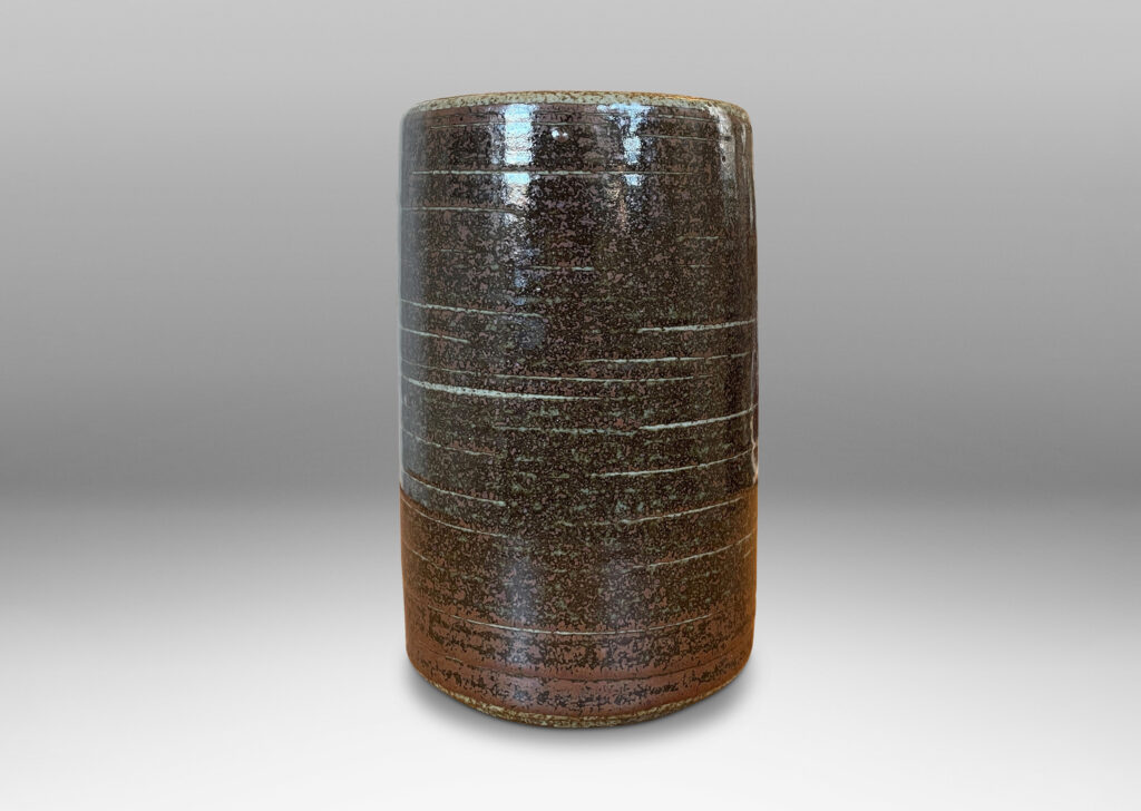 Gallery BAC cylindrical form glazed in black-red luster and speckled gray; stoneware