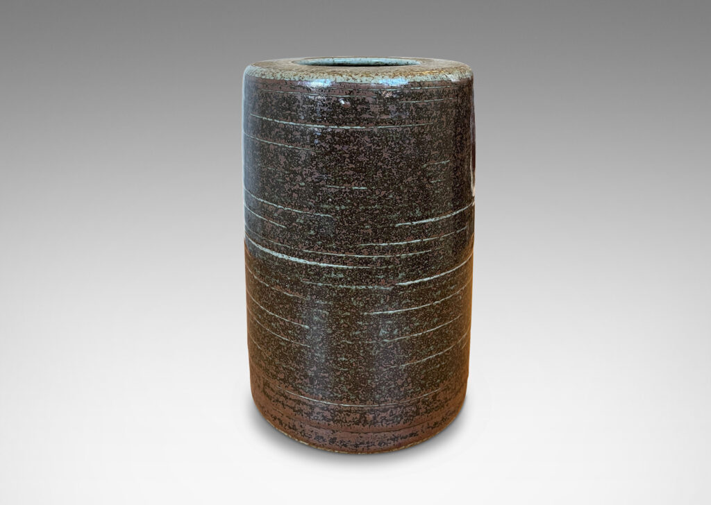 Gallery BAC cylindrical form glazed in black-red luster and speckled gray; stoneware