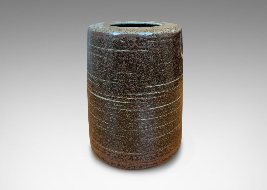 Gallery BAC cylindrical form glazed in black-red luster and speckled gray; stoneware