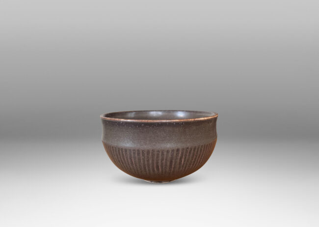 Gallery BAC rounded form with coved edge and carved hatch design, glazed in a rich deep brown