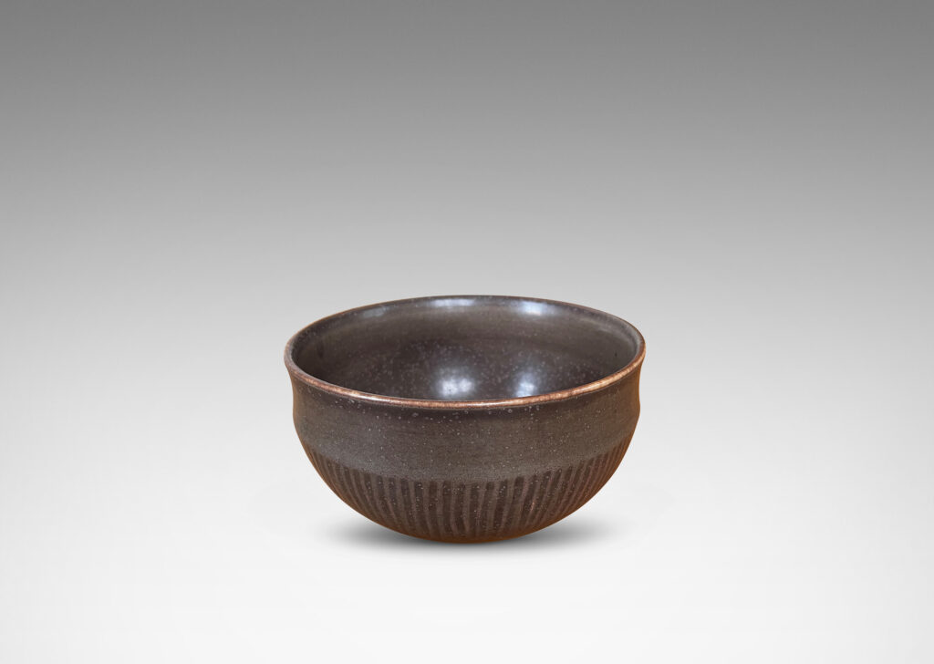 Gallery BAC rounded form with coved edge and carved hatch design, glazed in a rich deep brown