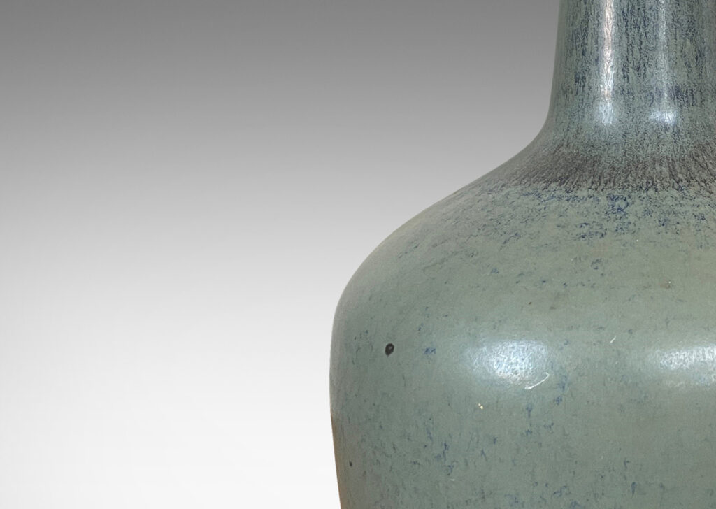 Gallery BAC tapered drum form and a tall sprouting neck, glazed in a light gray-blue