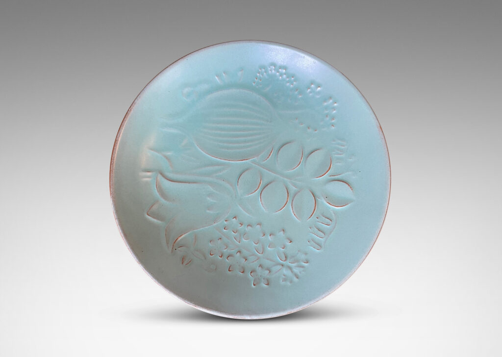 Gallery BAC smoothly modeled concave form with relief floral design inside, glazed in a muted celadon green