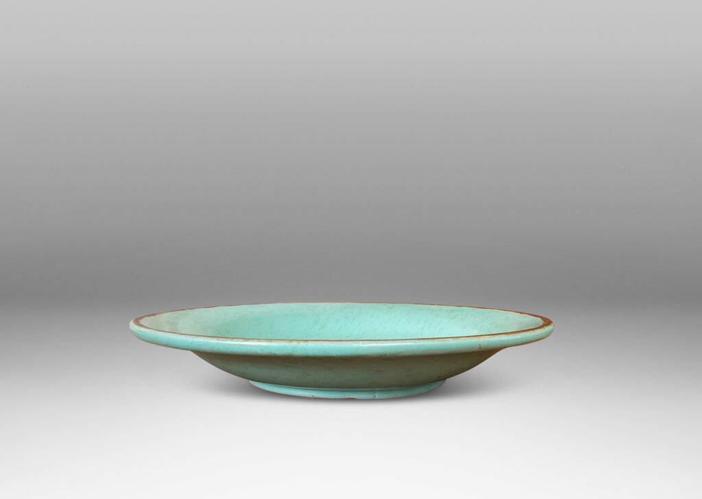 Gallery BAC shallow round form in turquoise glaze with brown rim and dappling