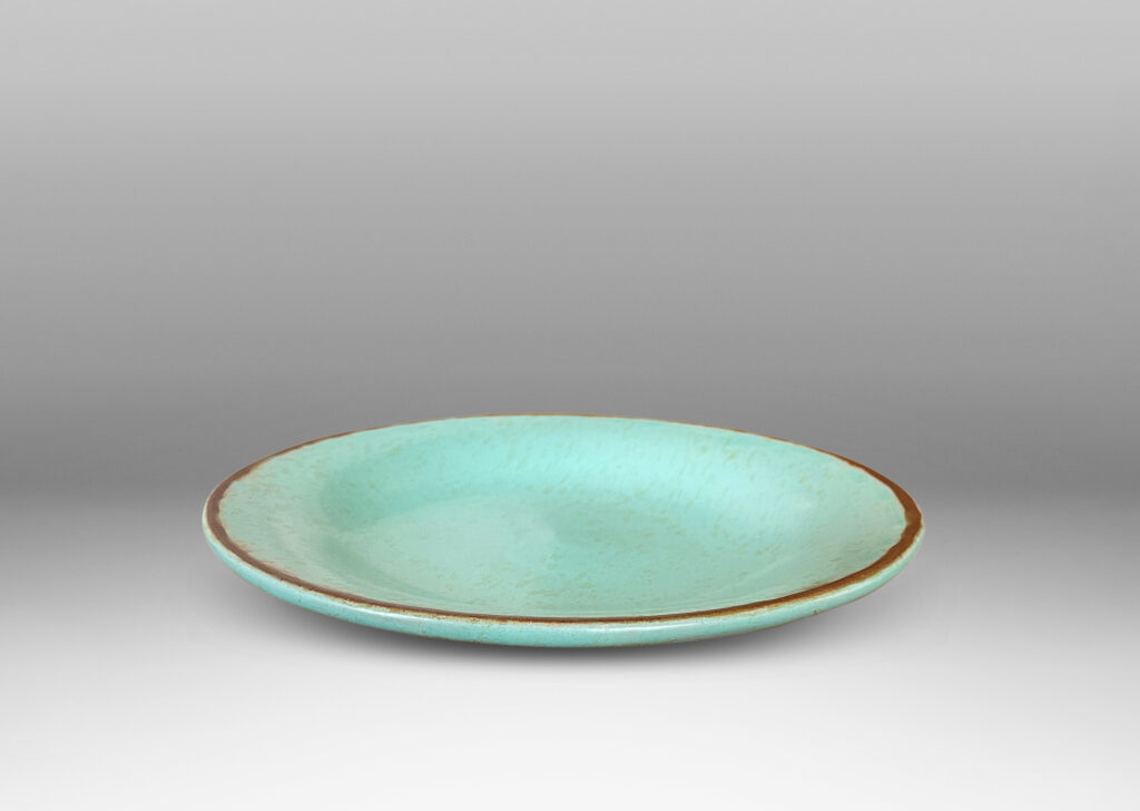 Gallery BAC shallow round form in turquoise glaze with brown rim and dappling