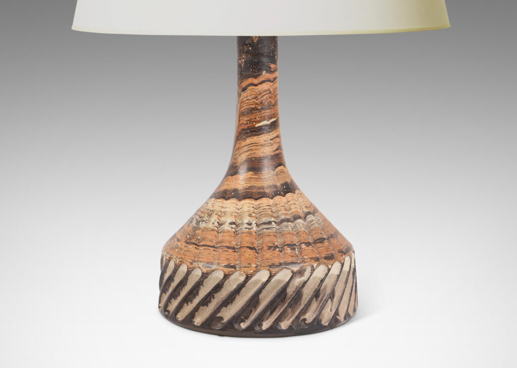 Gallery BAC large pawn-like form, with low drum and tall sprouting neck, glazed in marbled dark brown