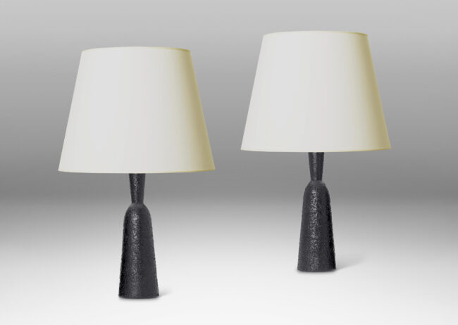 Gallery BAC all and tapered bottle-like forms, with a textured dark gray-black finish evoking the skin of an avocado