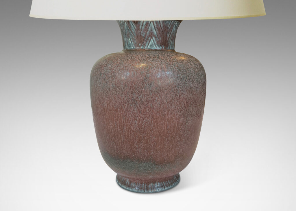 Gallery BAC tapered form with flared necks, carved with an Egyptian style chevron pattern, and glazed in a dappled plum-purple with blue accents