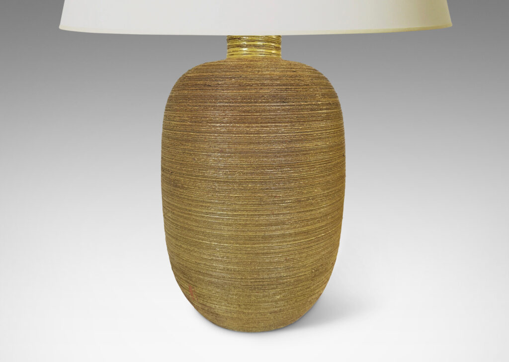 Gallery BAC ovoid forms with horizontally raked texture and matte ochre-tan glaze