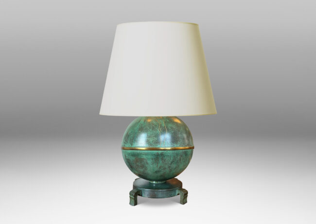 Gallery BAC globe form mounted on a stand with sculpted legs and featuring an immaculate original verdigris finish and subtle engraved designs; bronze with iron weight