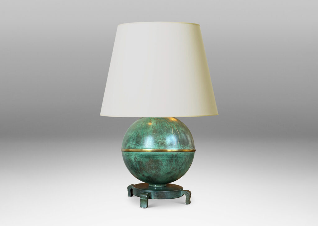 Gallery BAC globe form mounted on a stand with sculpted legs and featuring an immaculate original verdigris finish and subtle engraved designs; bronze with iron weight