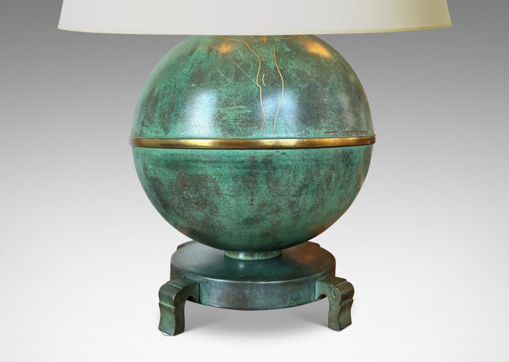 Gallery BAC globe form mounted on a stand with sculpted legs and featuring an immaculate original verdigris finish and subtle engraved designs; bronze with iron weight