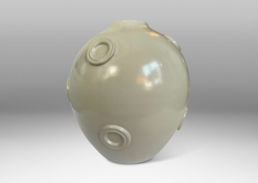 Gallery BAC ovoid form with applied relief floating circle motifs, glazed in a pale greige tone