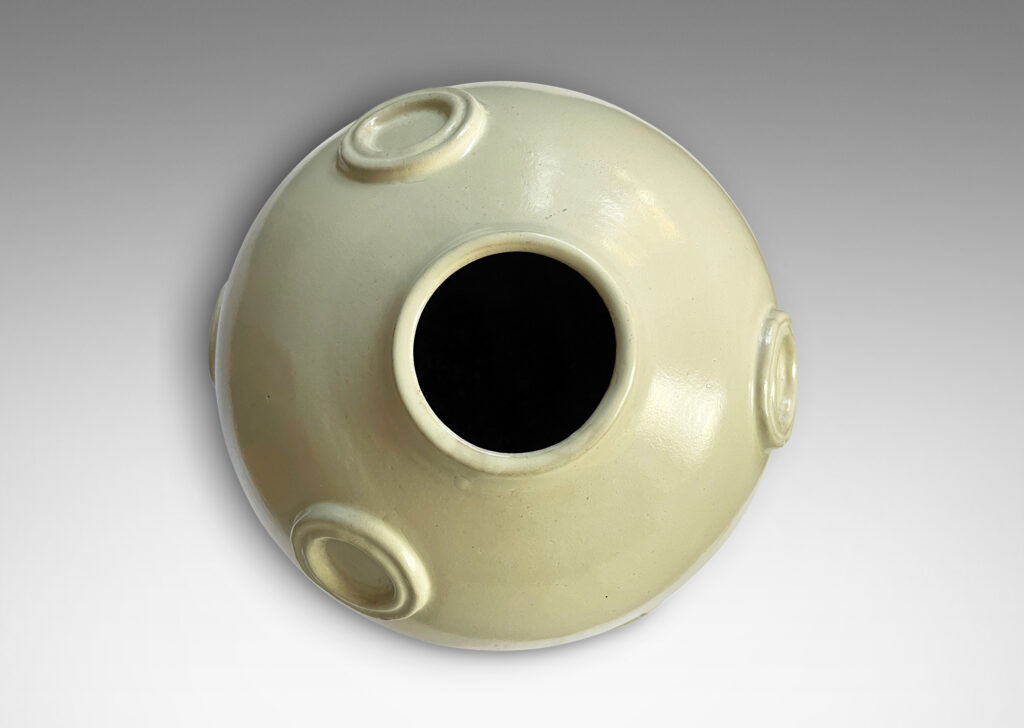 Gallery BAC ovoid form with applied relief floating circle motifs, glazed in a pale greige tone