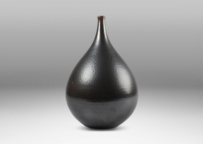 Gallery BAC having a drop form glazed in an orange peel finish dark brown