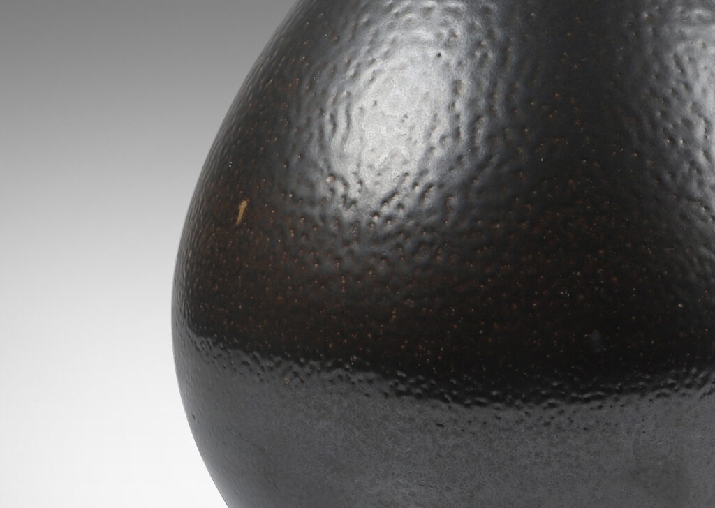 Gallery BAC having a drop form glazed in an orange peel finish dark brown