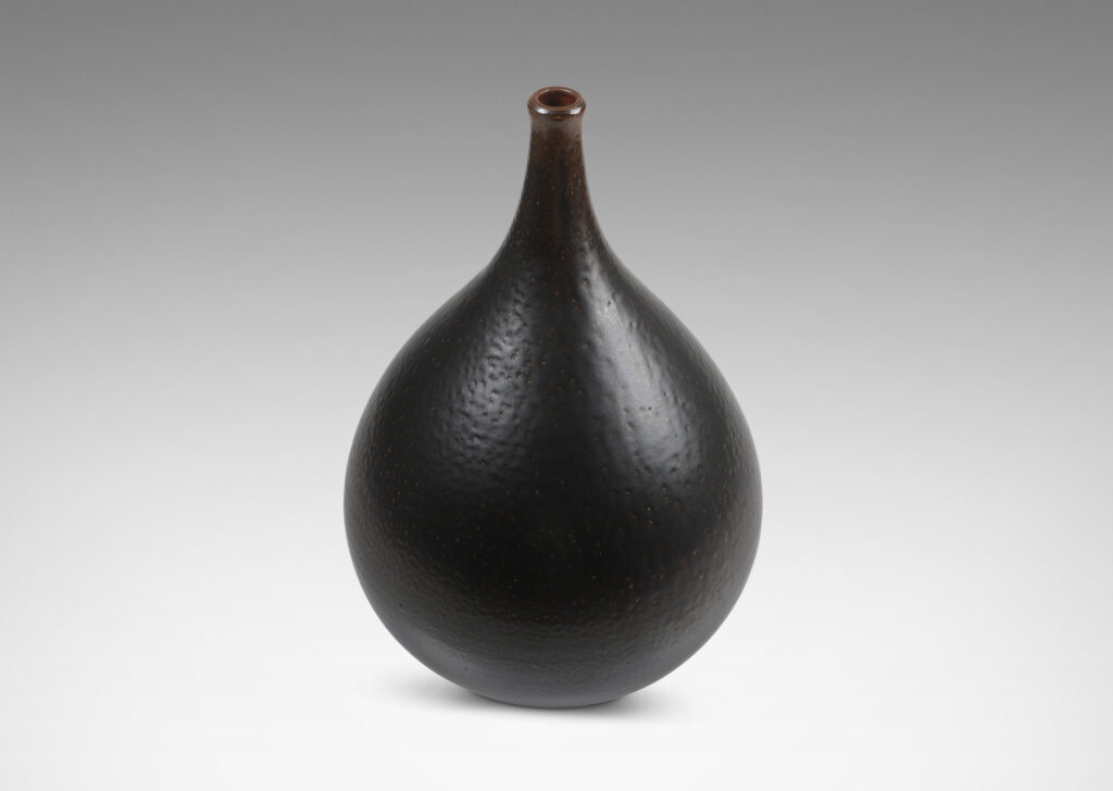 Gallery BAC having a drop form glazed in an orange peel finish dark brown