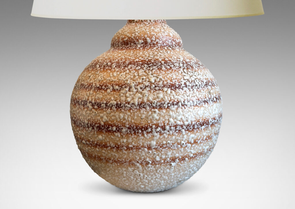 Gallery BAC globe form with calabash-like neck, in ombre tan and brown horizontal banding, with white “crispé” style overglaze