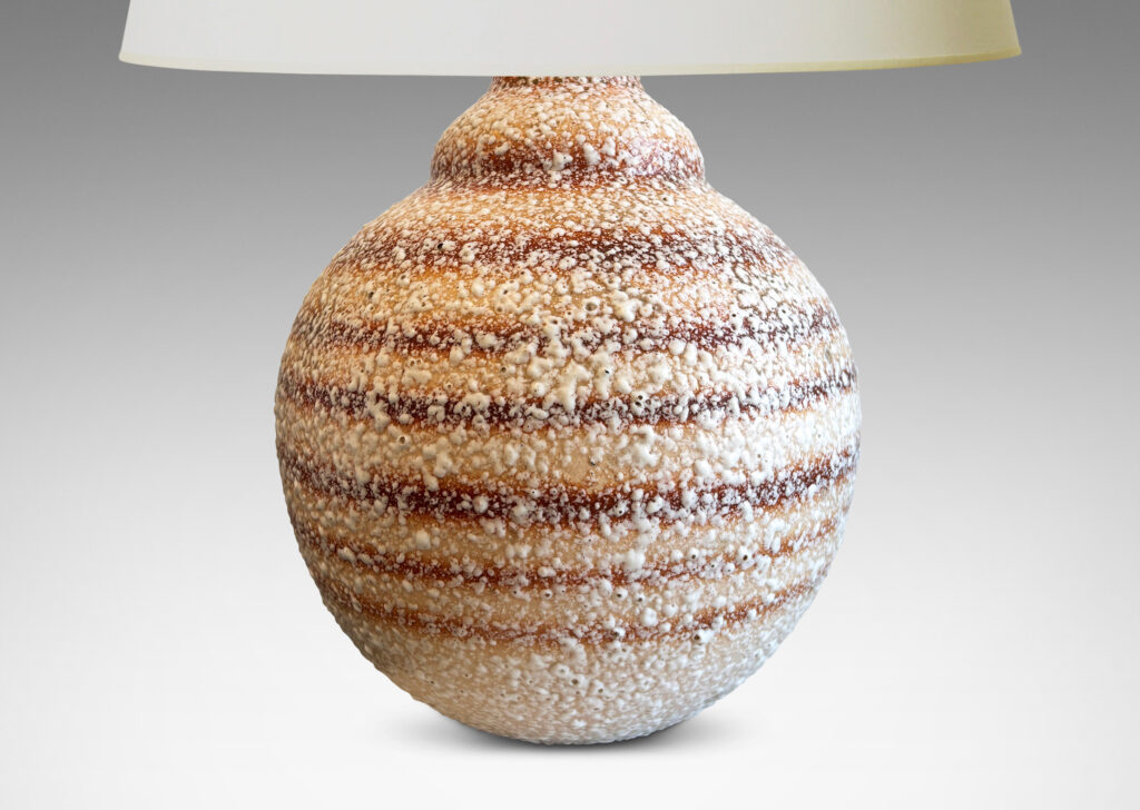 Gallery BAC globe form with calabash-like neck, in ombre tan and brown horizontal banding, with white “crispé” style overglaze